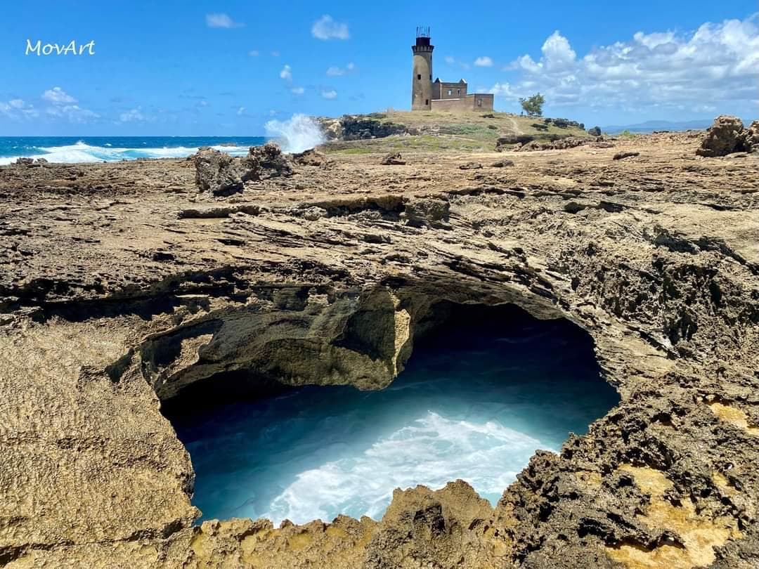 Natural pool with historic lighthouse in Mauritius