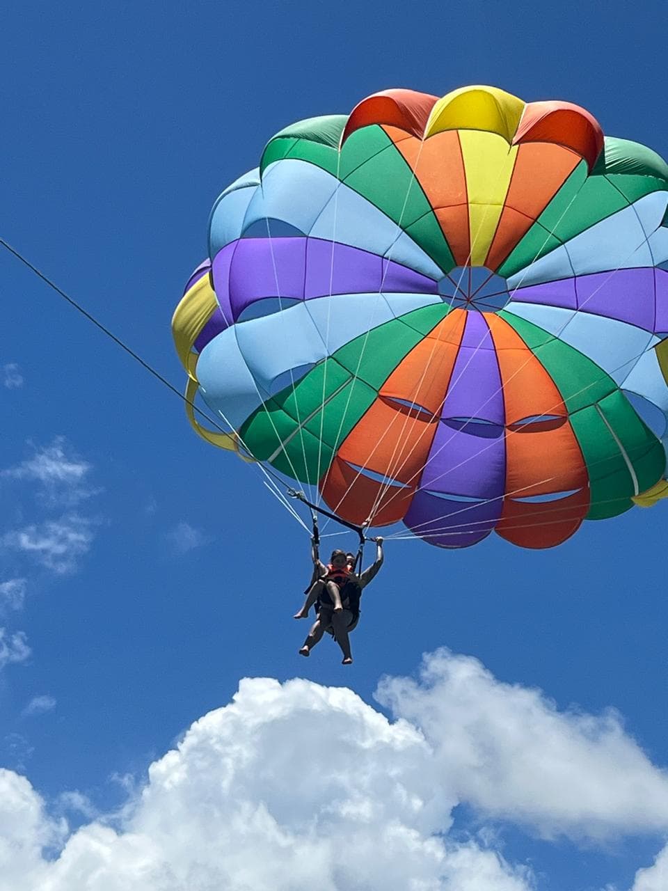 Parasailing adventure over the turquoise lagoon in Mauritius